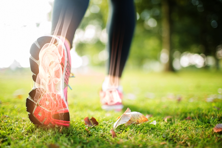 Highlighted foot bones of jogging woman