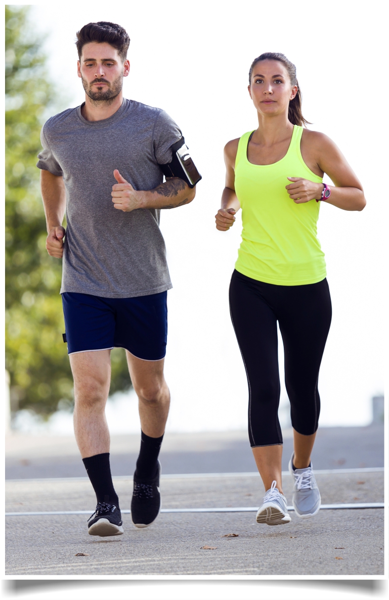 Couple running in street